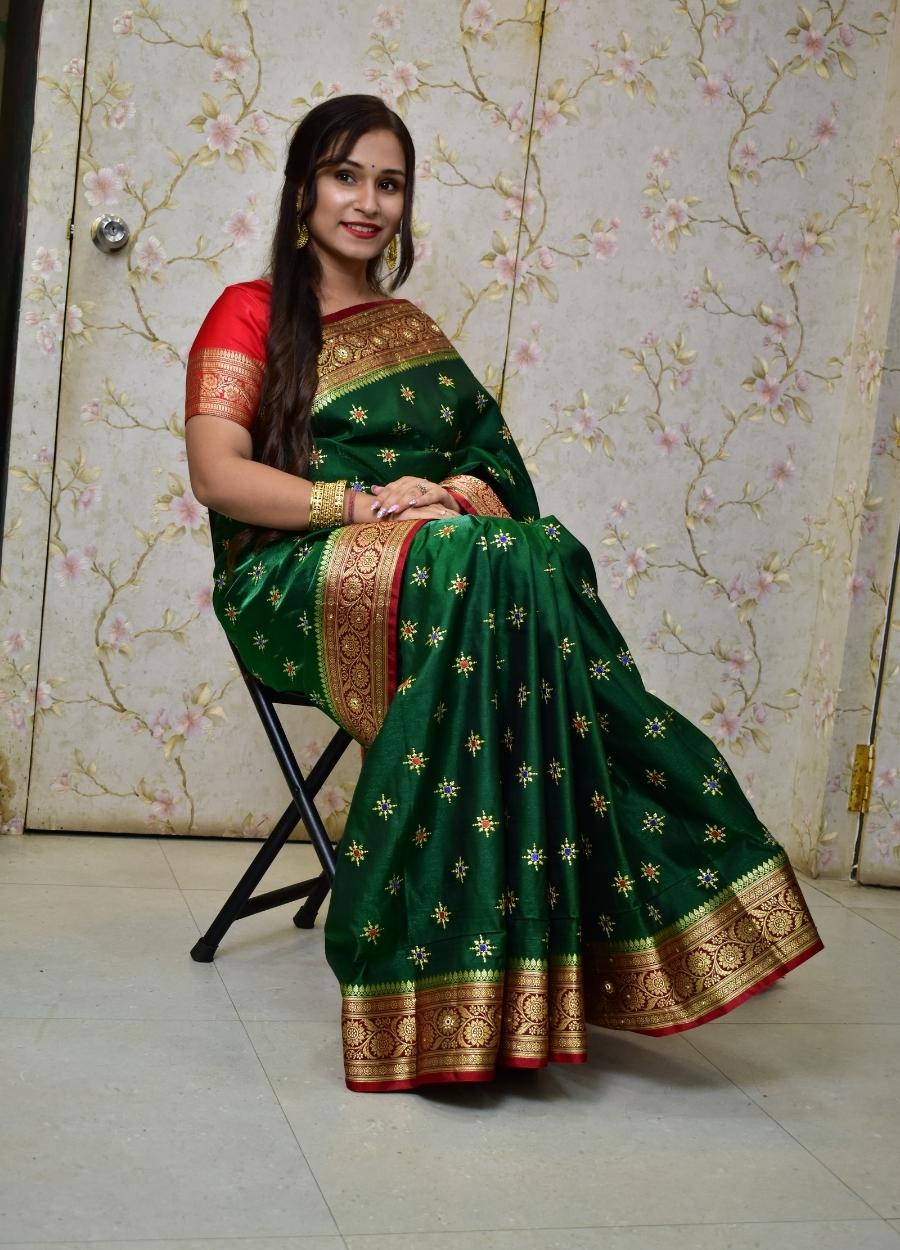 Green Banarasi satin silk saree with all over embroidery and Resham work with stone